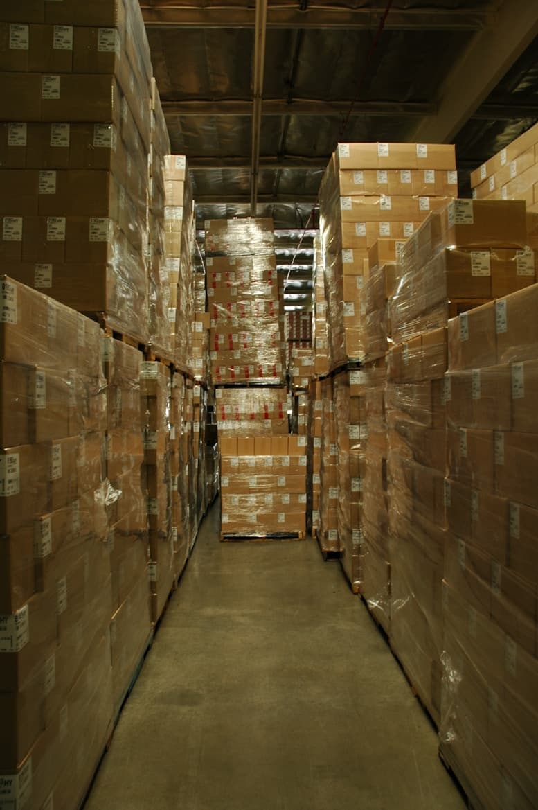 Warehouse aisle with stacked frozen products